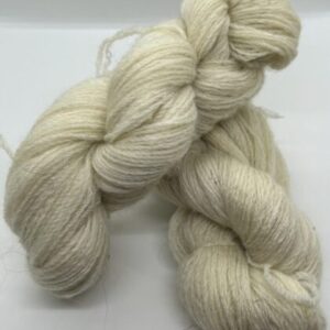 Two skeins of fine spun off white yarn.